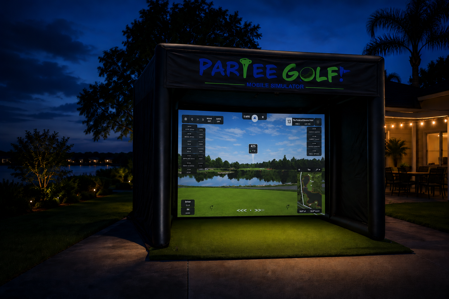 ParTee Golf mobile simulator bay lit up at night in a backyard
